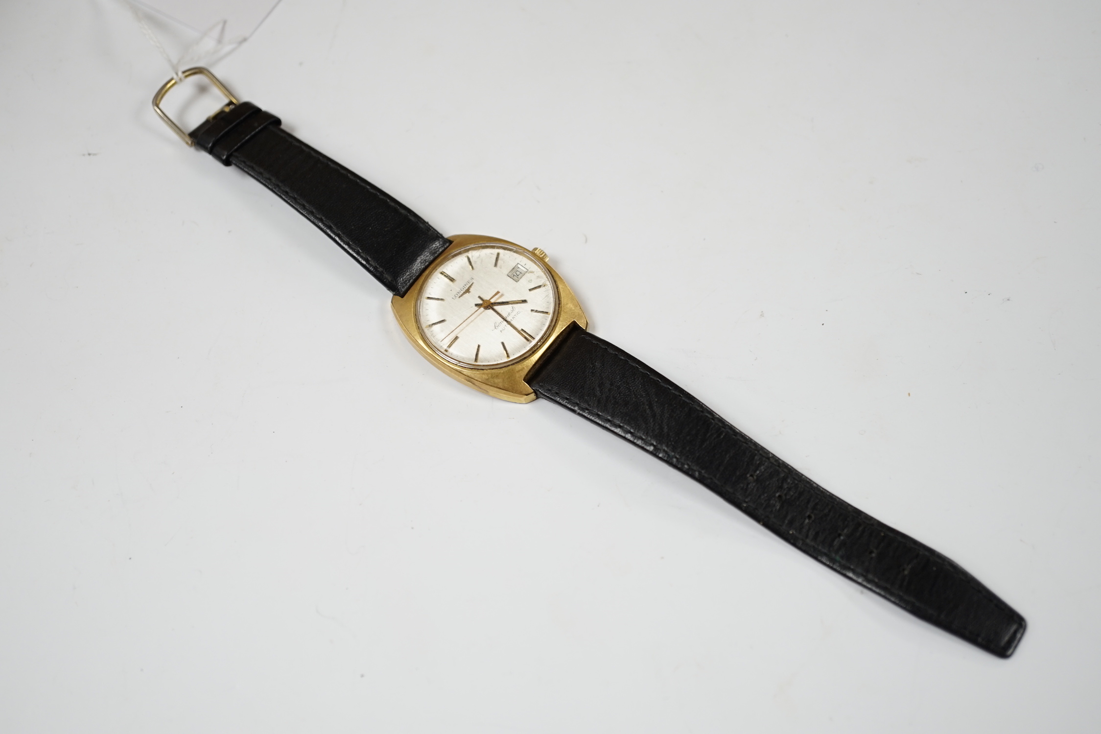 A gentleman's steel and gold plated Longines Conquest automatic wrist watch, with date aperture, on associated leather strap, case diameter 34mm.